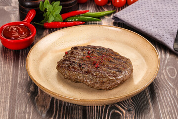 Grilled beef burger cutlet with sauce