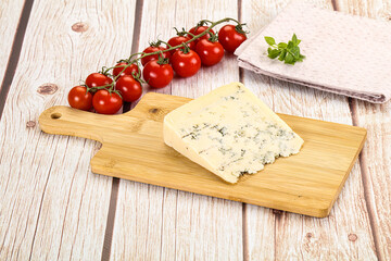 Blue cheese with mold over board