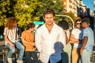 Portrait of stylish young man with white t-shirt and friends