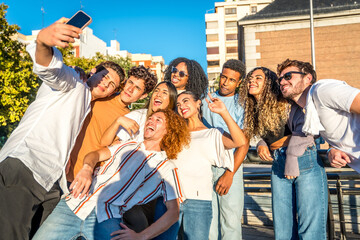 Smiling friends enjoying a day at city taking selfie together