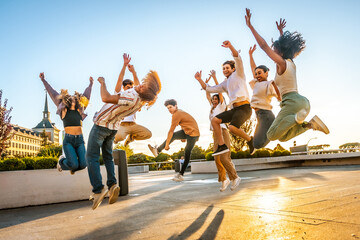 Friends jumping dancing free in the city