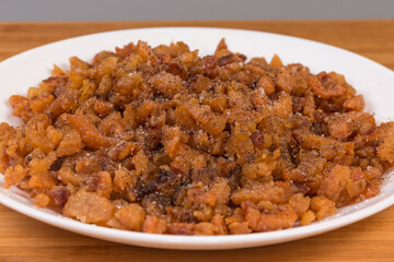 Duck сracklings with salt and pepper on dish close-up