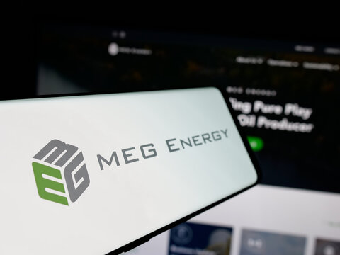 Stuttgart, Germany - 01-30-2025: Smartphone with logo of Canadian oil company MEG Energy Corp. on screen in front of business website. Focus on left of phone display.
