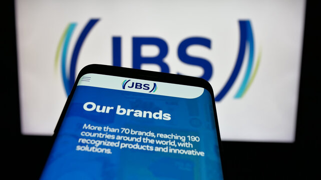 Stuttgart, Germany - 01-30-2025: Mobile phone with website of Brazilian meat processing company JBS S.A. on screen in front of business logo. Focus on top-left of phone display.