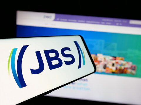 Stuttgart, Germany - 01-30-2025: Smartphone with logo of Brazilian meat processing company JBS S.A. on screen in front of business website. Focus on center-left of phone display.