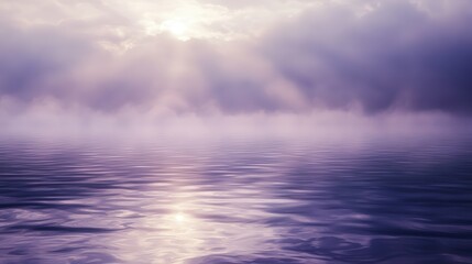 Sunlight pierces through mist over tranquil waters at dawn creating a serene atmosphere