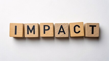 Wooden blocks spelling impact symbolize the significance of communication in business strategies and decision-making processes.