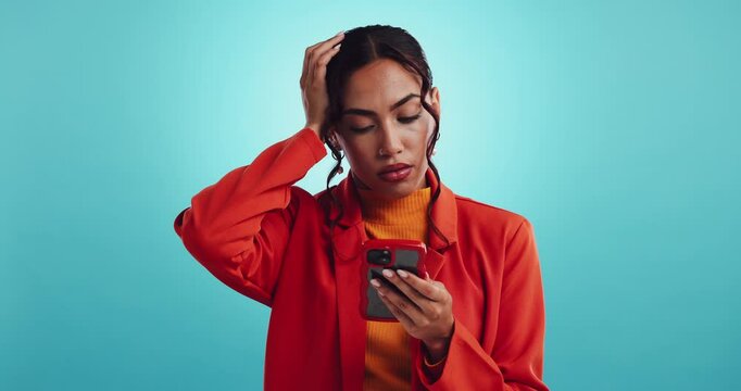 Face, confused and woman in studio, smartphone and facial expression on blue background. Portrait, person and model with cellphone, doubt and emotion with mistake, network loss and questions with app