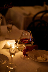 An aesthetic red wine on the table at night in a restaurant