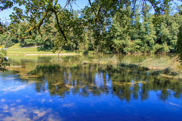 View of Krka river on the shore in Dolenjska, Slovenia.