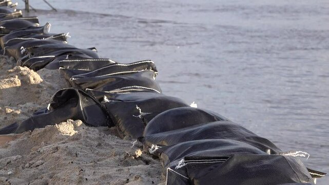 Sandbags protect city center of Deventer during high water levels in the Netherlands, flood risk and natural disaster in Europe
