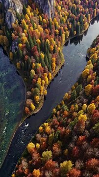 River cutting through autumn-painted valley, surrounded by golden forests and rocky cliffs, warm orange and red color palette, evoking peaceful serenity.
