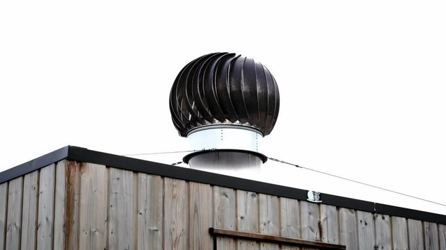 Industrial rooftop ventilation system in circular shape. Modern metal structure for airflow and building cooling, shot from above in daylight. Ideal for architecture and engineering themes.

