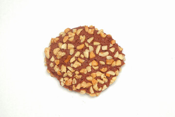 Top view of chocolate cookies with peanut topping isolated on white background.Sweet and crunchy taste.Copy space for text.For graphic design or 3D rendering.Snack food business concept