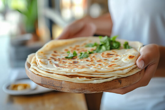 a satisfied customer at Paratha House Delhi, enjoying a delicious paratha and embodying the positive dining experience at the restaurant.