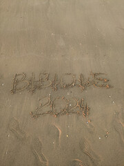Bibione 2024 etched in sand on an italian beach, capturing the essence of summer in san michele al tagliamento, veneto