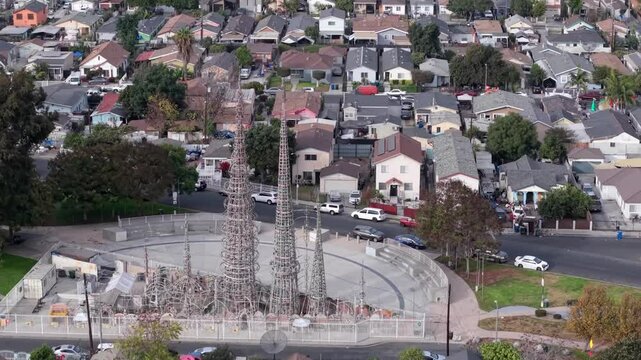 Iconic Los Angeles landmark, the Watts Towers and adjoining residential neighborhood, aerial view highlights sculpture amidst the vibrant urban landscape