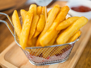 Basket of crispy french fries. Close up