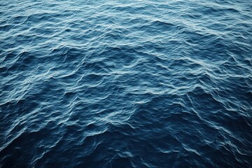 Fototapeta premium Calm Ocean Waves with Deep Blue Tones Reflecting Light
