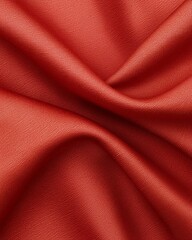 Fototapeta premium A close-up image of smooth, folded orange fabric, showcasing its rich texture and vibrant hue. Ideal for designers and marketers seeking elements for fashion, textiles, or decor.