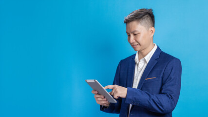 Confident young businessman in a blue suit standing holding a phone in various emotions
