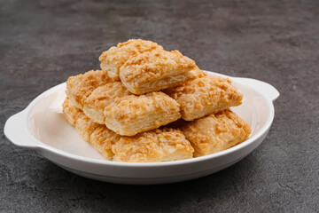 Crunchy pastry cookies with almond sprinkles 
