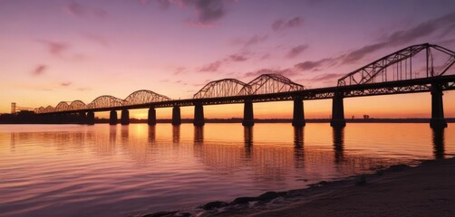 Fototapeta premium Sunset over the Mississippi River with a bridge in the distance, sunset, water, natural