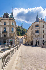 Fototapeta premium Main street of the city center, Stritarjeva ulica with Ljubljana castle, Ljubljanski grad, Ljubljana, Slovenia.