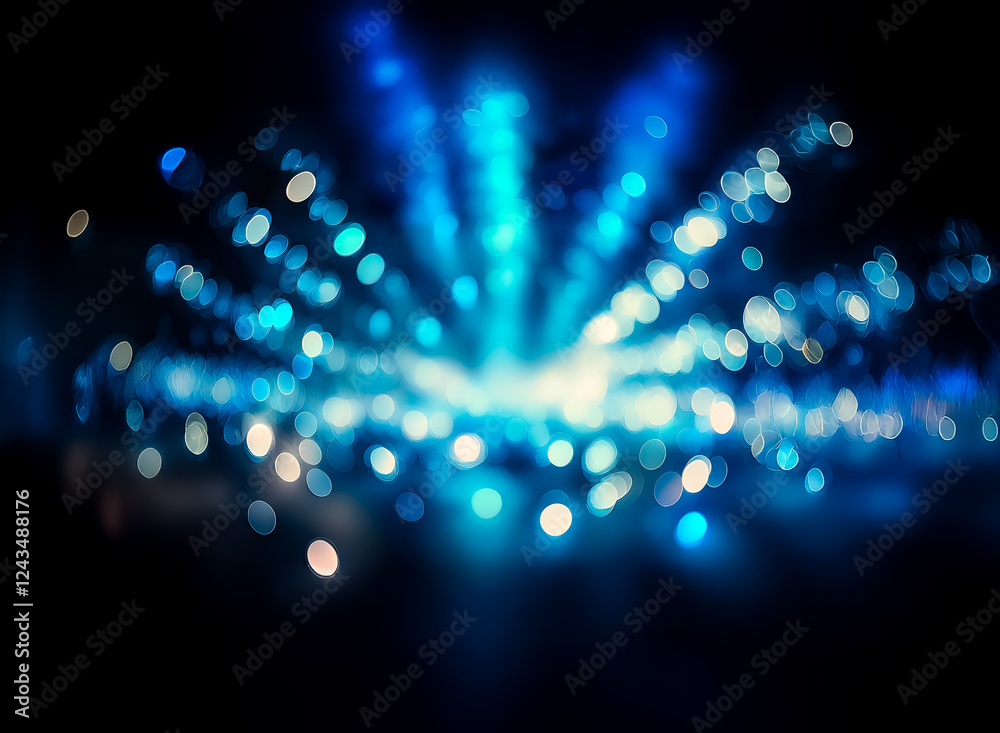 Aufkleber Blurred blue and white bokeh lights radiate from a central point on a dark background, creating an abstract and luminous effect. The lights are soft and out of focus, suggesting movement or distance.