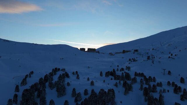 Kleine Scheidegg Village at Sunset in Winter. Swiss Alps. Switzerland. Aerial View. Moving Forward 