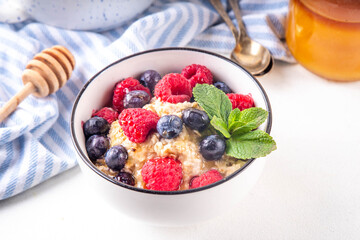 Breakfast oatmeal with fresh berries and honey