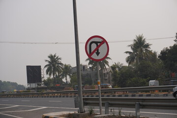 Making U-turn and right turn is provided in that location sign board