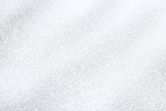 shimmering silver background with soft, sparkling texture creates serene and elegant atmosphere. This versatile backdrop is perfect for various design projects