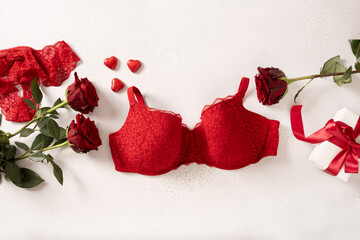 Valentine's day banner with red gift, bustier underwear, wine and chocolate sweets on white...