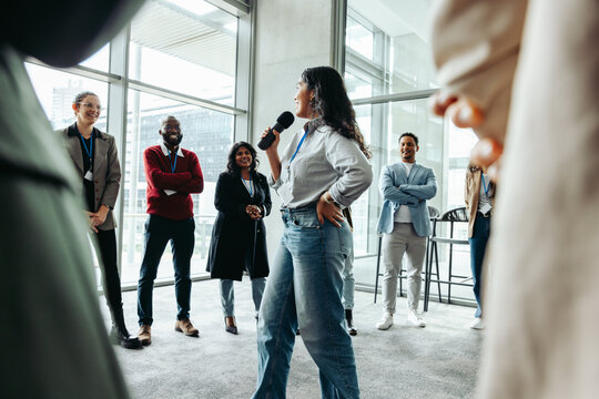 Business workshop with a diverse group of professionals engaged in team-building activities