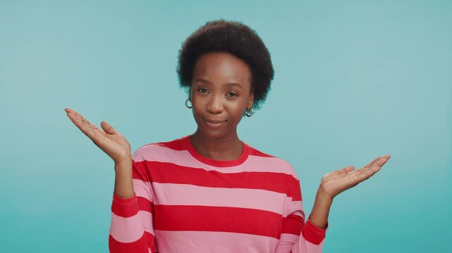 Choice, hands and face of black woman in studio for retail option, shopping budget plan and decision. Scale, mockup space and balance with person on blue background for discount code comparison