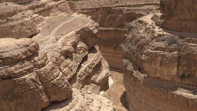 Close-up of steep gorges of Mides canyon, arid mountain landscape and wilderness in Tunisia
