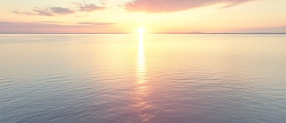 Fototapeta premium Serene sunset over calm ocean waters.