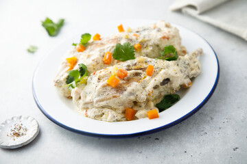 Rabbit with sour cream sauce and vegetables
