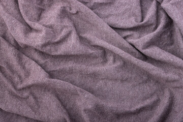 Abstract soft draped fabric texture background in muted purple tone