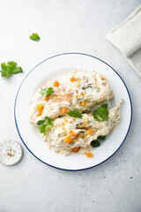 Rabbit with sour cream sauce and vegetables