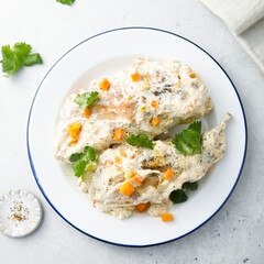 Rabbit with sour cream sauce and vegetables