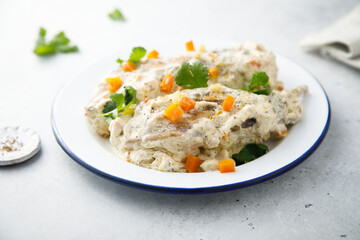 Rabbit with sour cream sauce and vegetables