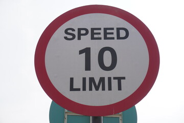 Speed limit sign board installed beside the highway to  maintain the speed limit of the vehicle within 10 km per hour