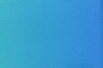 A vibrant blue fabric with a tight honeycomb pattern, creating a modern and clean texture. Ideal for use in fashion, interior design, or as a versatile background element. Blue gradient.
