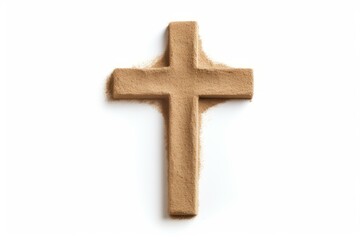 Christian cross made of sand resting on a white background, representing faith, spirituality, and religion