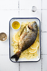 Baked dorado with lemon and couscous