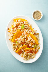 Pumpkin with quinoa and pine nuts