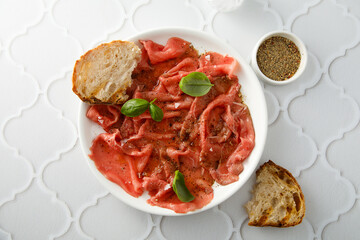 Traditional beef carpaccio with truffle oil