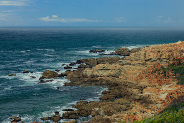 Coastal view of rocky shoreline along the South African coast during sunny day